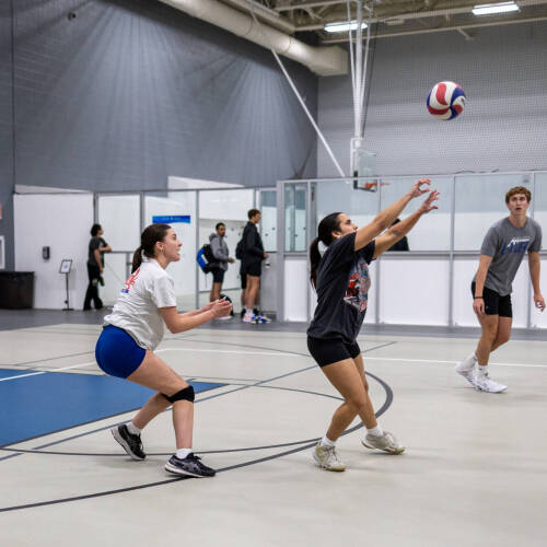 students playing volleyball